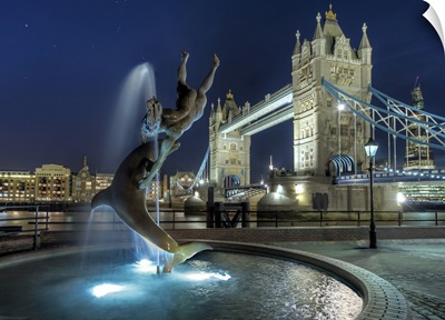 Tower Bridge with  dolphin fountain in London.