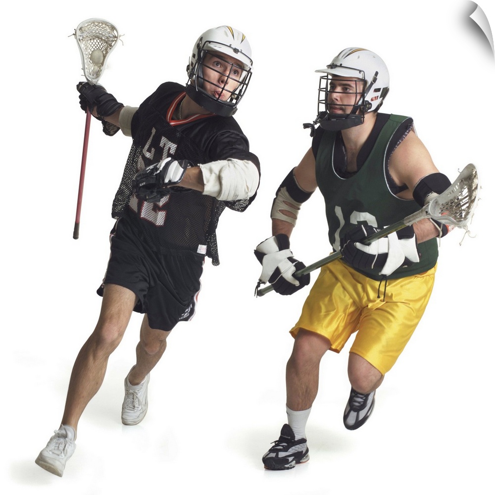 two caucasian male lacrosse players from opposite teams run as the one in the green jersey tries to block the one in black