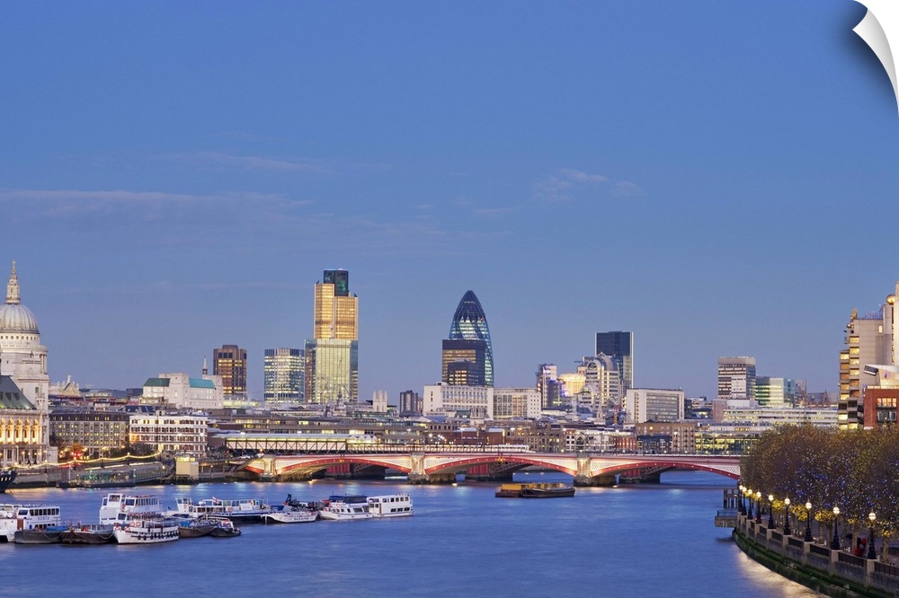 UK, London, view of city skyline and St Paul's Cathedral at dusk across River Thames
