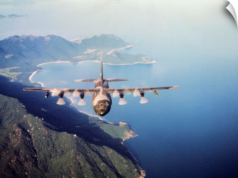 Vietnam. a U.S. Airforce c-130 Hercules flies along the South Vietnamese coast on a cargo and passenger mission in support...