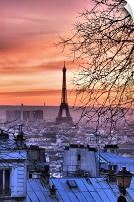View of Eiffel Tower and Paris roofs from Montmartre at sunset, Paris, France.