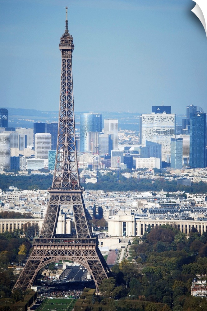 View of Eiffel Tower (La Tour Eiffel) from top of Montparnasse Tour in Paris France. Skyscrapers of La Defense business di...