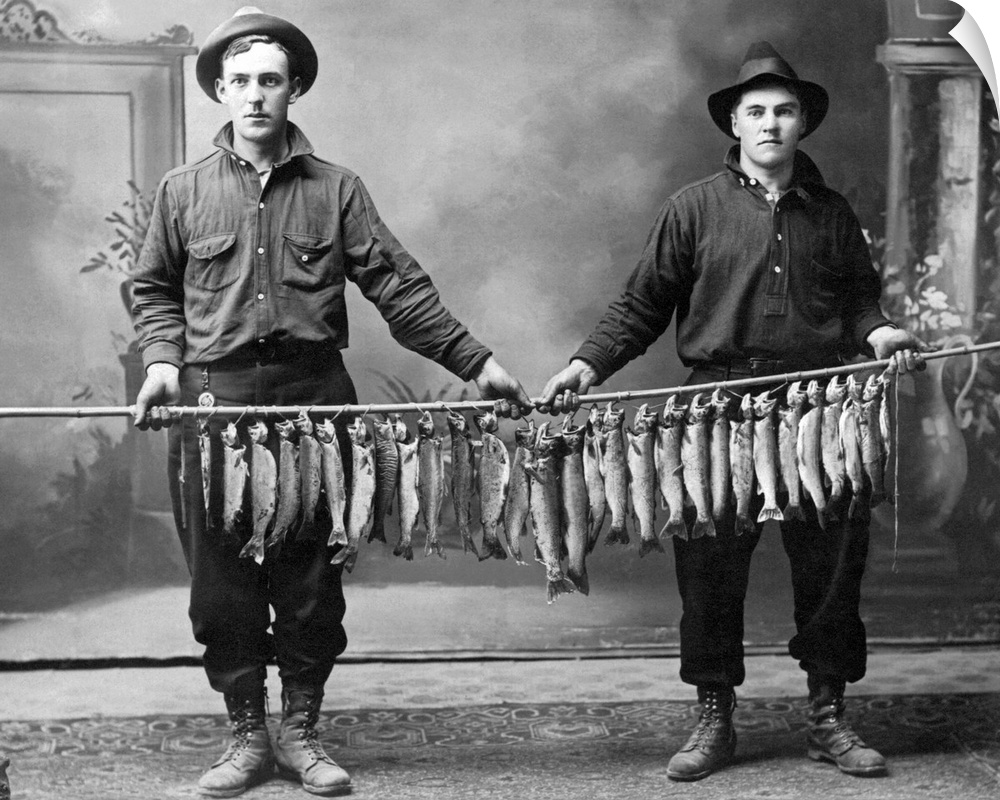 Vintage image of men holding string of fish