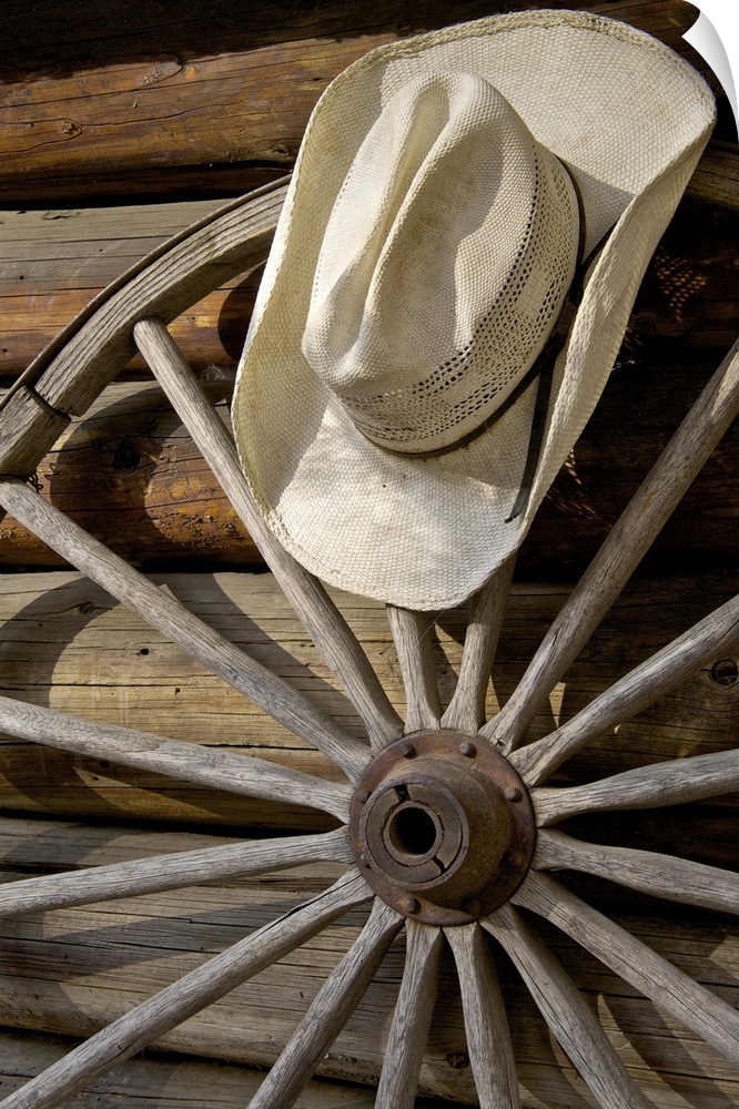 Wagon wheel and cowboy hat by log cabin, Merced Lake, High Sierra Camp, Yosemite, California, USA
