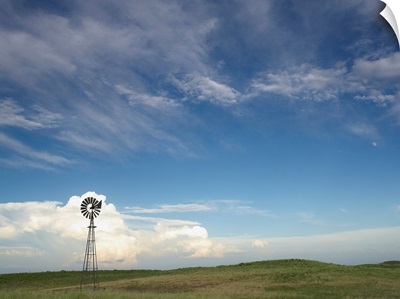 Windmill in field