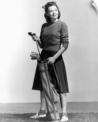 Woman Holding Golf Club And Golf Bag