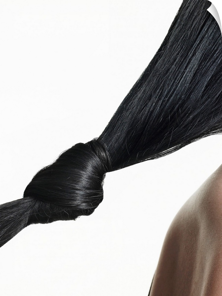 Woman with hair tied in knot, close-up of hair