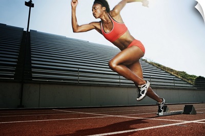 Women running on athletic track