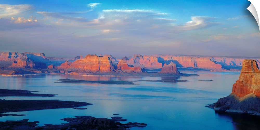 A photograph of lake powell under sky with approaching clouds.