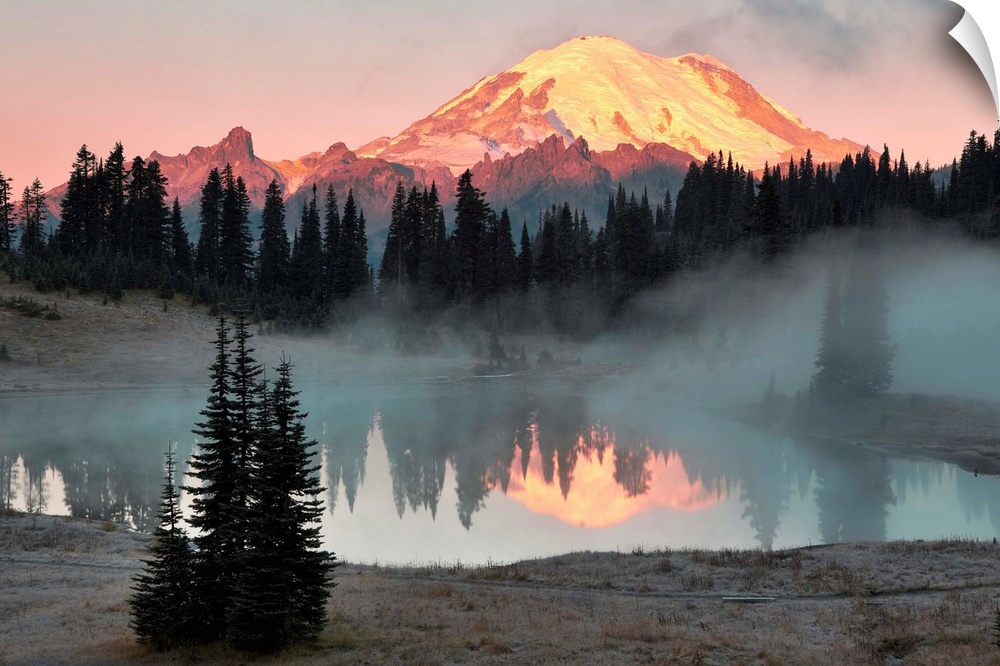 Fine art photo of sunlight hitting the snow peak of Mount Rainier, Washington.