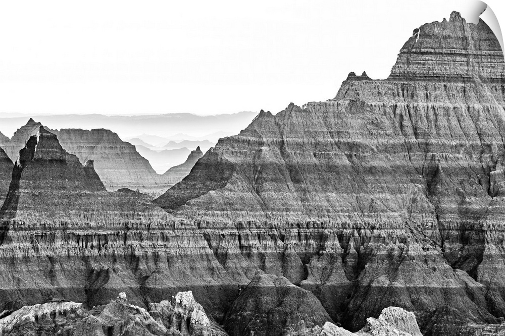 The wonderful layers of South Dakota's Badlands National Park fade into the distant haze. This gorgeous black-and-white ph...