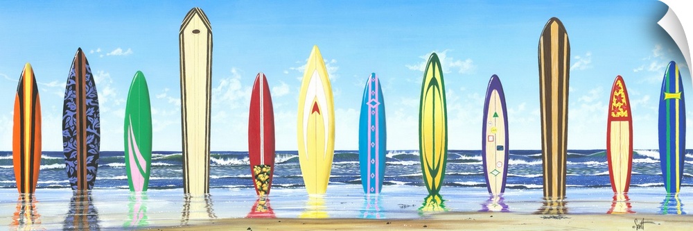Panoramic photograph of color surfboards standing in sand with the ocean in the background.
