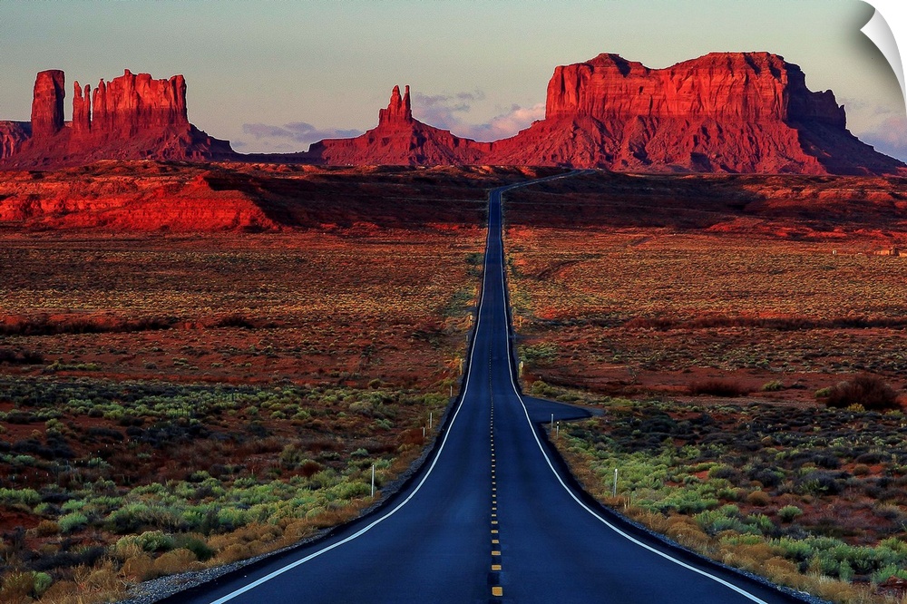 Photograph of a road dividing the Arizona and Utah deserts.