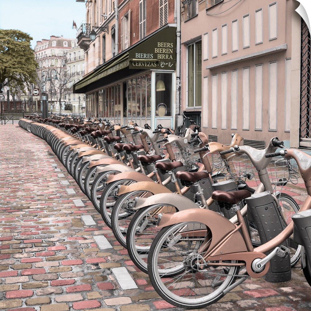 Square image of a row of rental bicycles in Paris, France.