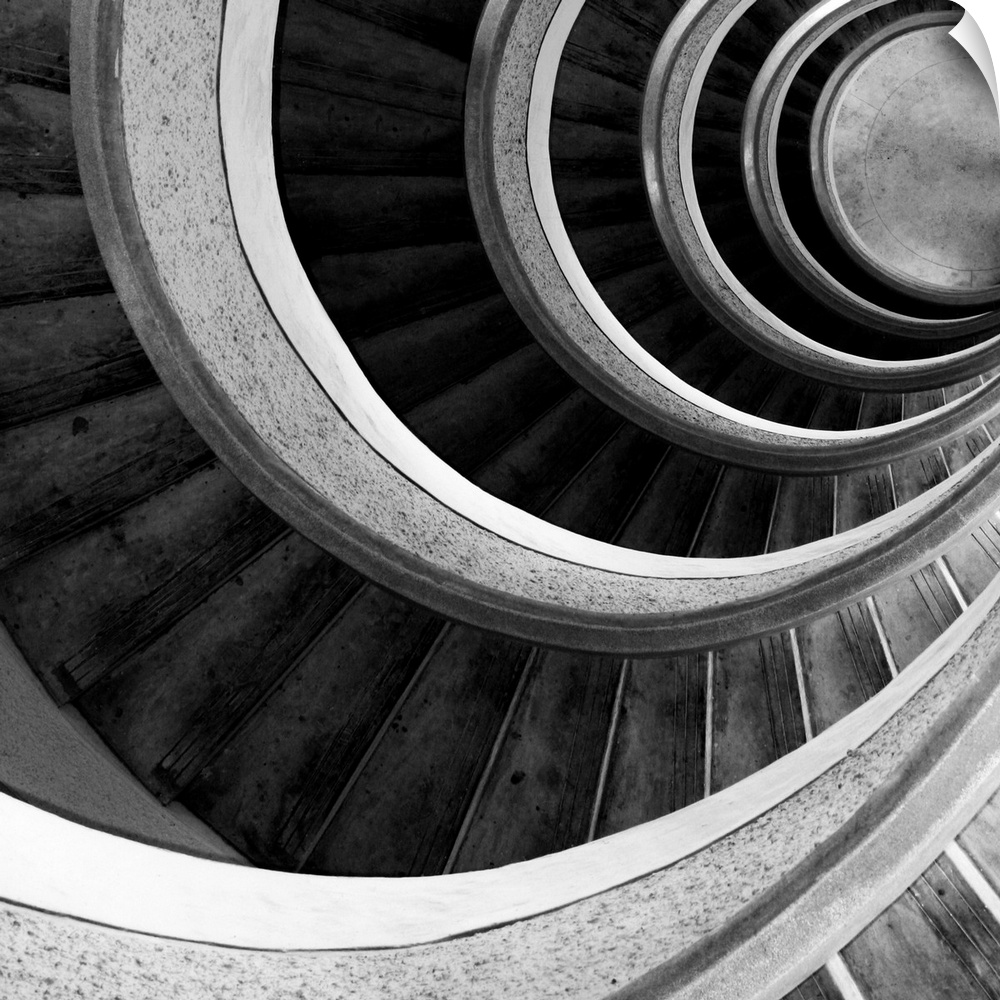 A spiral staircase inside a tower looking down