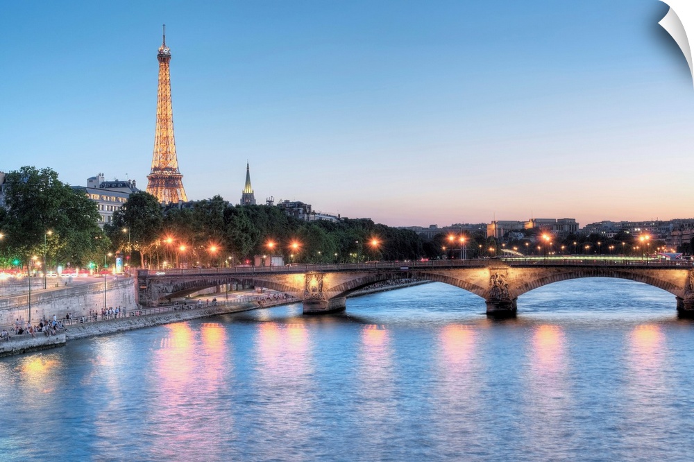 A photograph of the Seine river in Paris with the Eiffel Tower in the background.