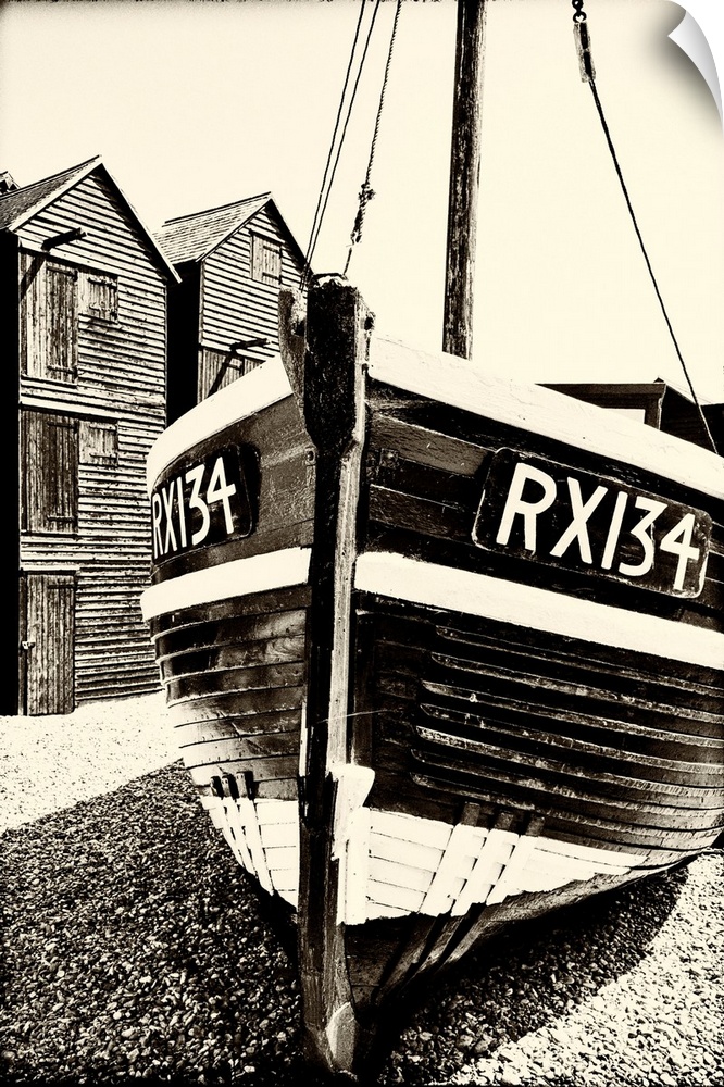 A fishing boat and the net shops ( a weather-proof storage for the fishing gear), Hasting Old Town, Sussex, England.