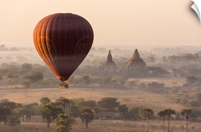 A hot-air balloon flying over pagodas in Bagan, Myanmar.