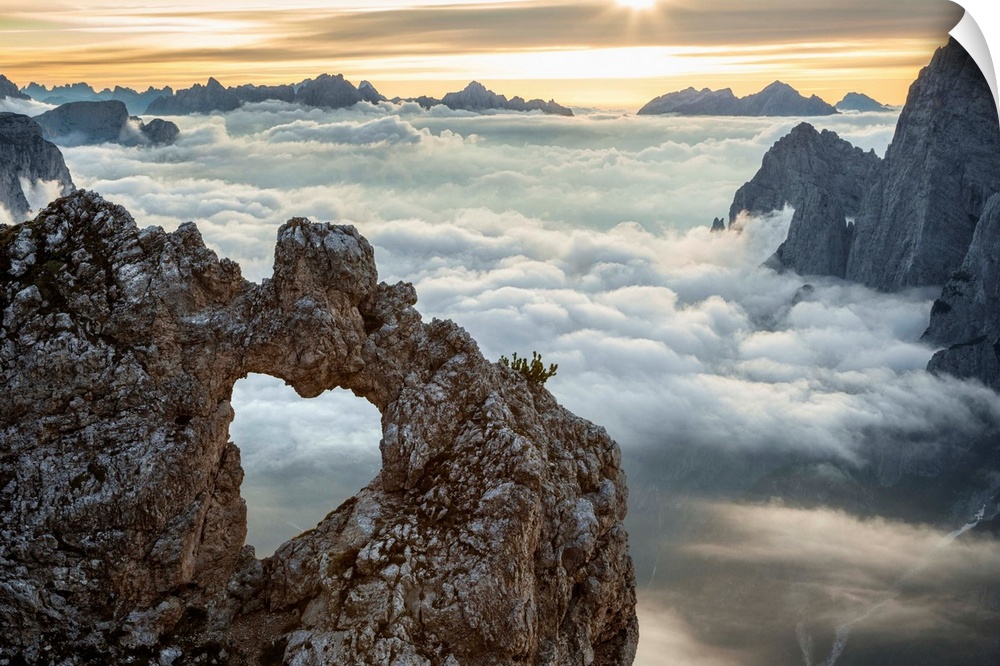 A rock's heart, on a cloud's sea, between rock walls. (Dolomites, Italy).