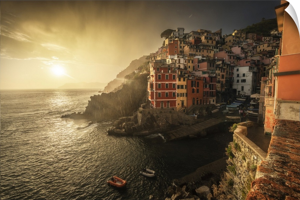 A stormy summer sunset in the town of Riomaggiore, one of the Cinque Terre. Cinque Terre, Italy