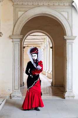 A Woman In A Costume And Mask Poses During The Venice Carnival, Venice, Italy