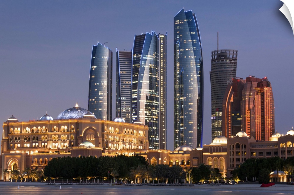UAE, Abu Dhabi, Etihad Towers and Emirates Palace Hotel, dusk.