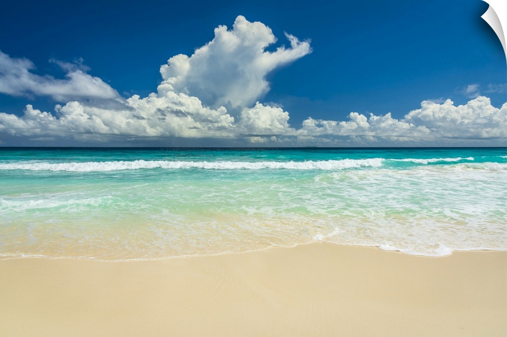 Africa, Seychelles, La Digue. Beach, sand, waves, clouds at Grand Anse.