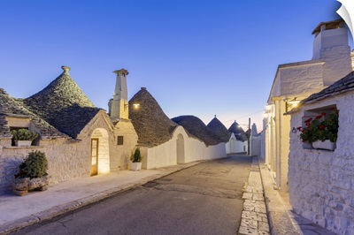Alley Between White Trulli Houses At Dusk, Unesco World Heritage Site, Apulia, Italy