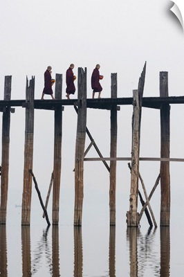 Amarapura, Mandalay region, Myanmar, Monks walking on the U Bein bridge