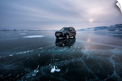 An Offroad Car Over A Flat Ice At The Lake Baikal, Irkutsk Region, Siberia, Russia
