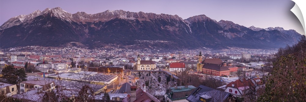 Austria, Tyrol,  Innsbruck, elevated city view with the Wilten Basilica and Wilten Abbey Church, dawn, winter