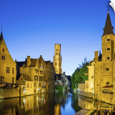 Belfort van Brugge and medieval buildings on the Dijver canal from Rozenhoedkaai at dusk