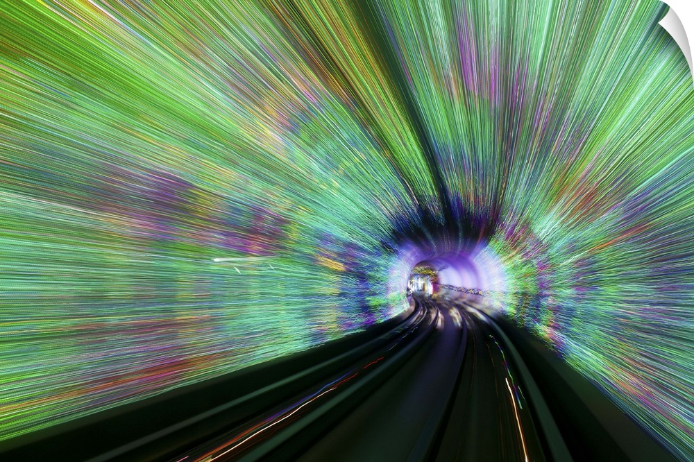 Blurred motion light trails in an train tunnel under the Huangpu tiver linking the Bund to Pudong, Shanghai, China