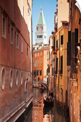 Campanile and gondola on canal in Venice, Italy