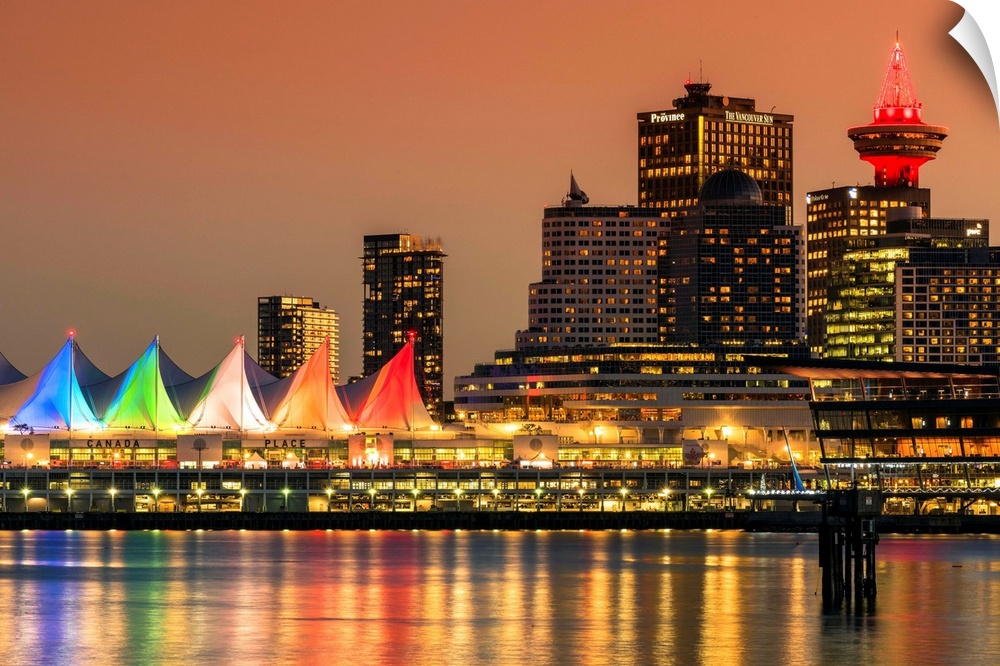View at sunset of Canada Place and Harbour Centre building decorated with Christmas lights, Vancouver, British Columbia, C...