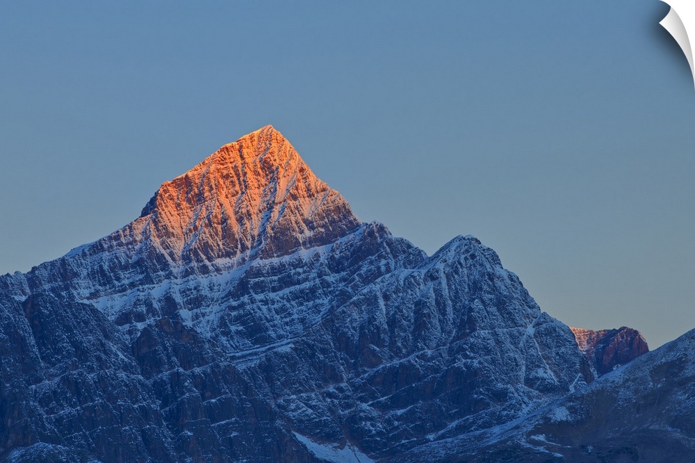 First light on a peak of the Canadina Rocky Mountains, Icefields Parkway, Jasper National Park, Alberta, Canada