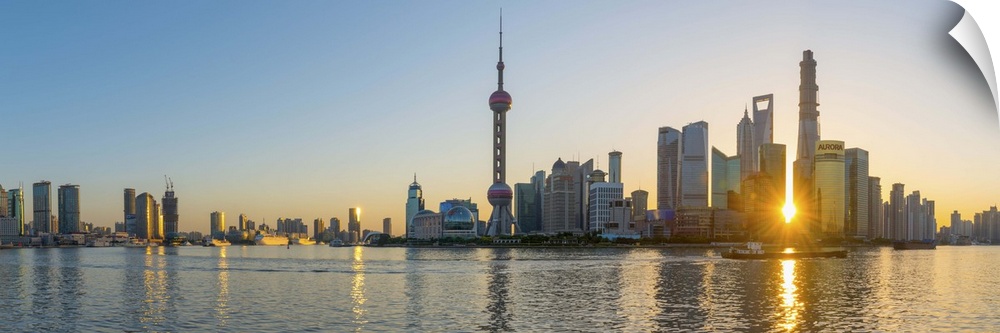 China, Shanghai, Pudong District, Skyline of the Financial District across Huangpu River at sunrise