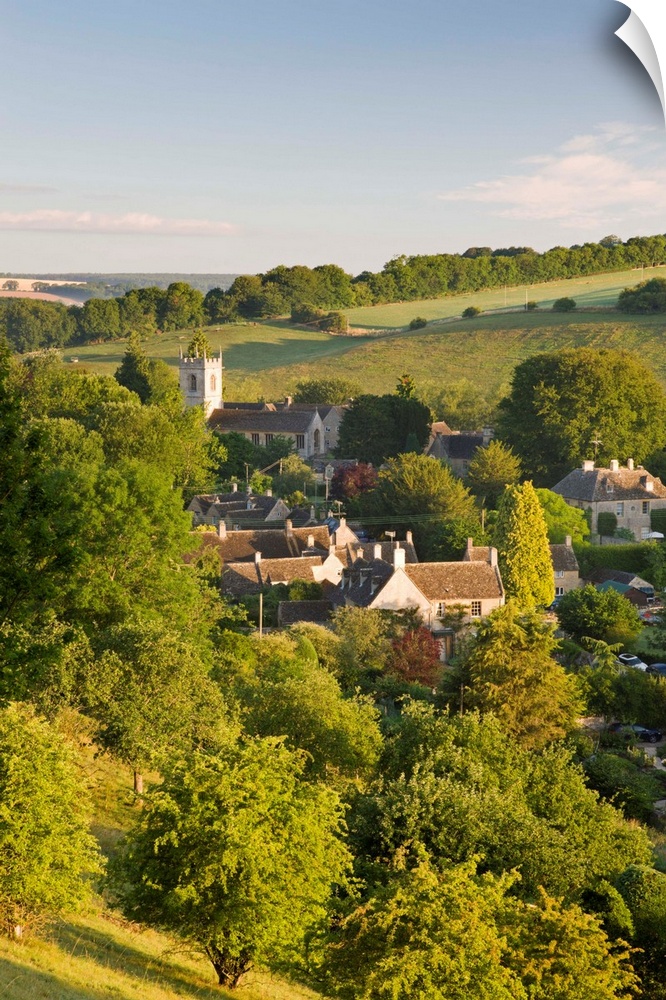 Cottages nestled into the valley in the picturesque Cotswolds village of Naunton, Gloucestershire, England. Summer