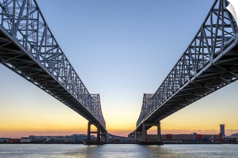 United States, Louisiana, New Orleans. Crescent City Connection, twin span bridges over the Mississippi River at sunset.