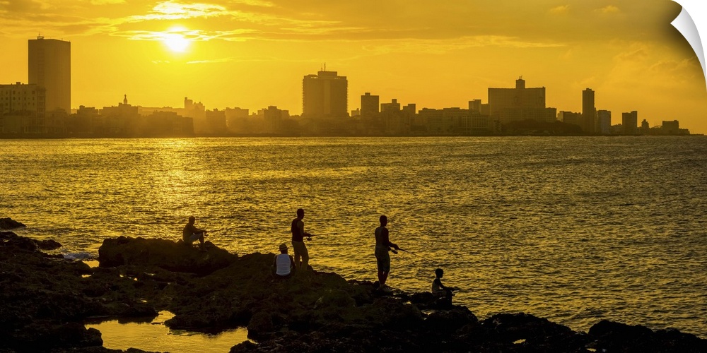 Cuba, Havana, The Malecon, Man fishing.