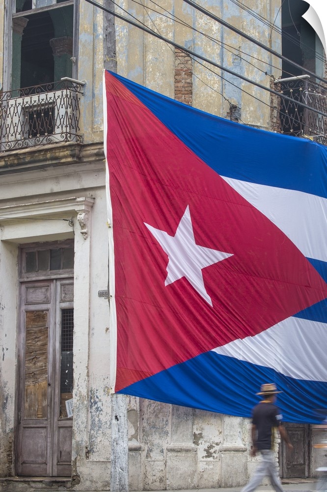 Cuba, Huge Cuban flag hanging across buildings in a street in  Santa Clara, after the death of Fidel Castro