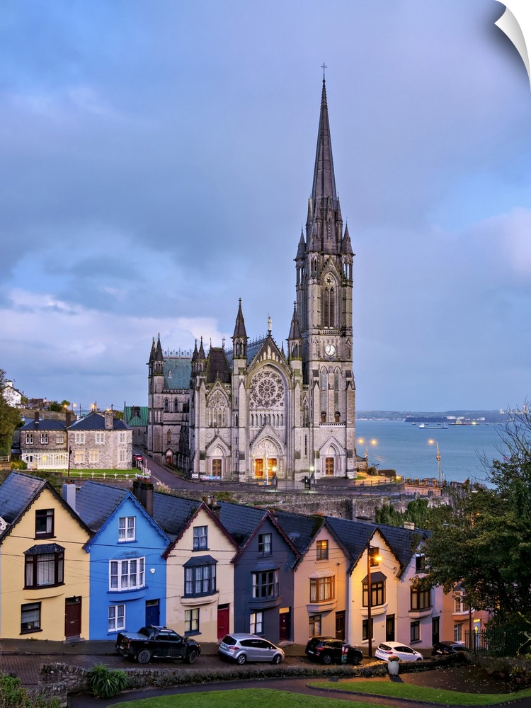 Deck of Cards colourful houses and St. Colman's Cathedral at dusk, elevated view, Cobh, County Cork, Ireland