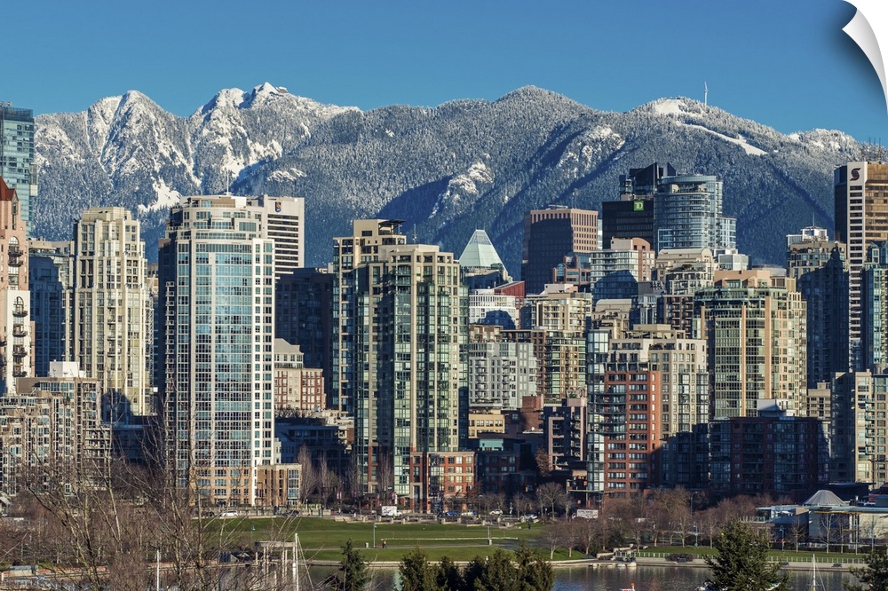 Downtown skyline with snowy mountains behind, Vancouver, British Columbia, Canada.