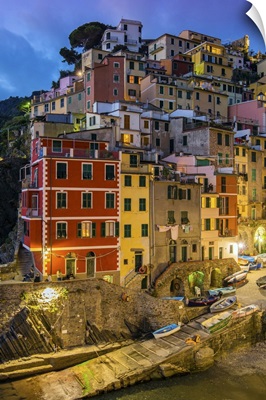 Dusk view of the colorful sea village of Riomaggiore, Cinque Terre, Liguria, Italy