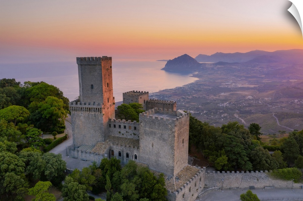 Erice, Sicily. The Norman castle at sunrise, view towards Monte Cofano and Riserva dello Zingaro mountains