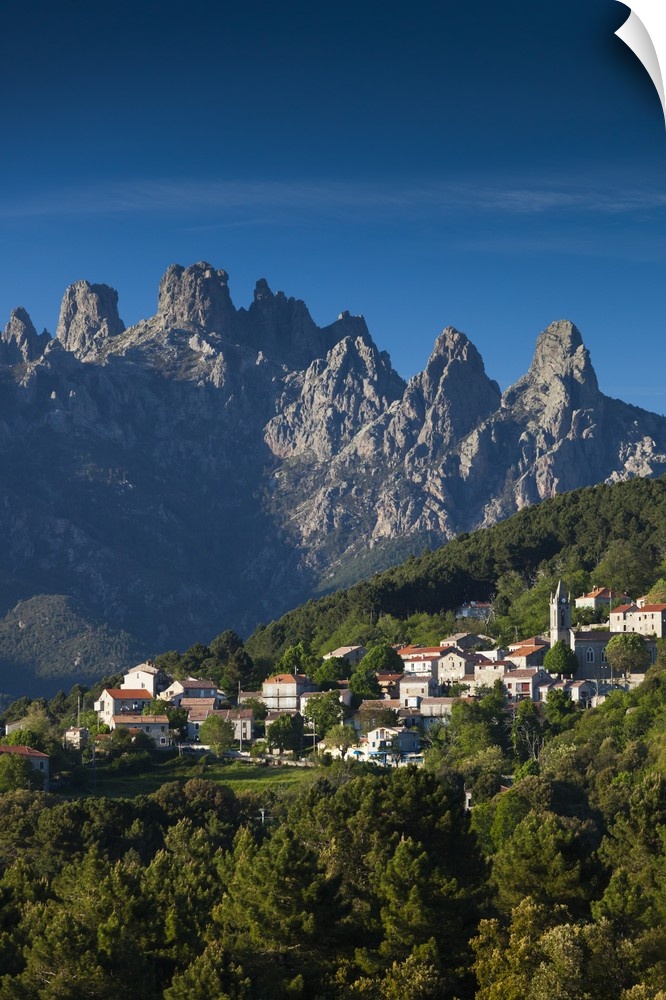 France, Corsica, Corse-du-Sud Department, La Alta Rocca Region, Zonza, elevated town view with the Aiguilles de Bavella peaks