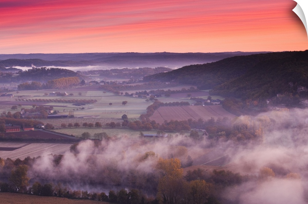 France, Aquitaine Region, Dordogne Department, Domme, elevated view of the Dordogne River Valley in fog from the Belvedere...