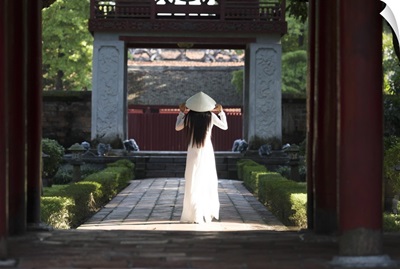 Girl wearing Ao Dai dress and Non La conical hat, Temple of Literature, Hanoi, Vietnam