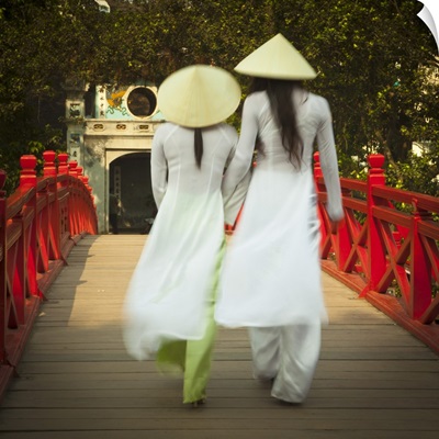 Girls wearing Ao Dai dress, Huc Bridge, Hoan Kiem Lake, Hanoi, Vietnam