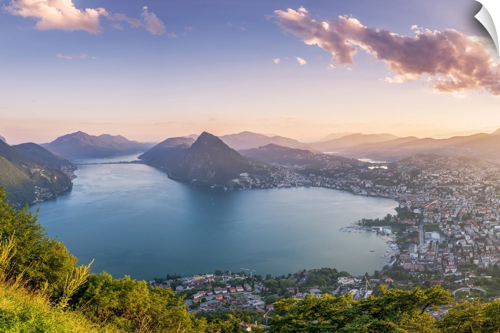 Lugano, lake Lugano, Ticino canton, Switzerland. High angle view from the Mount Bre at sunset.